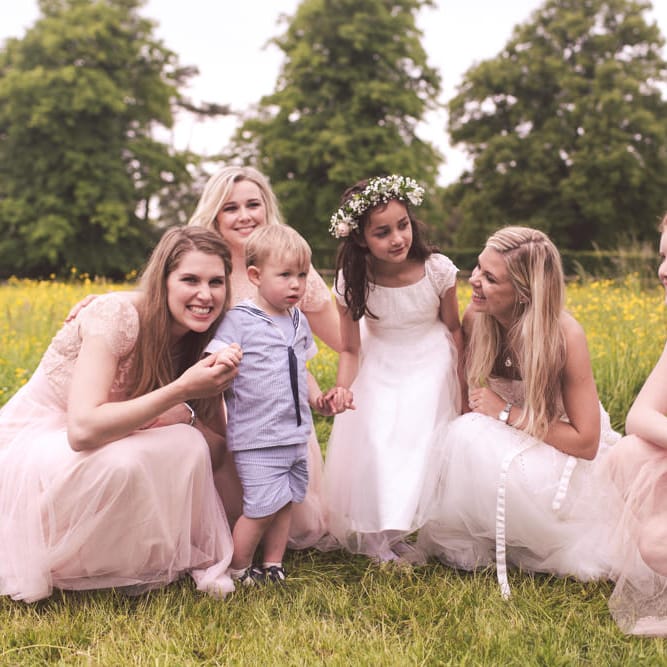 Bride in Monique Lhuillier Candy Wedding Dress & Bridesmaids in Pink BHLDN Dresses