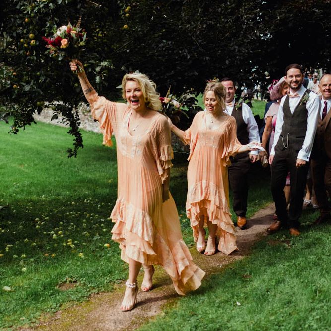 Bridesmaids in Peach Free People Dresses | Outdoor Wedding at Dewsall Court Oxfordshire | Claudia Rose Carter Photography | Costa Sister Productions