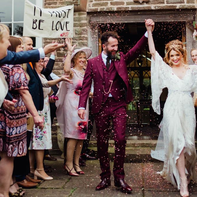 Confetti Exit | Bride in Rue de Seine Cleo Wedding Dress | Groom in Burgundy Suit | Outdoor Wedding at Dewsall Court Oxfordshire | Claudia Rose Carter Photography | Costa Sister Productions