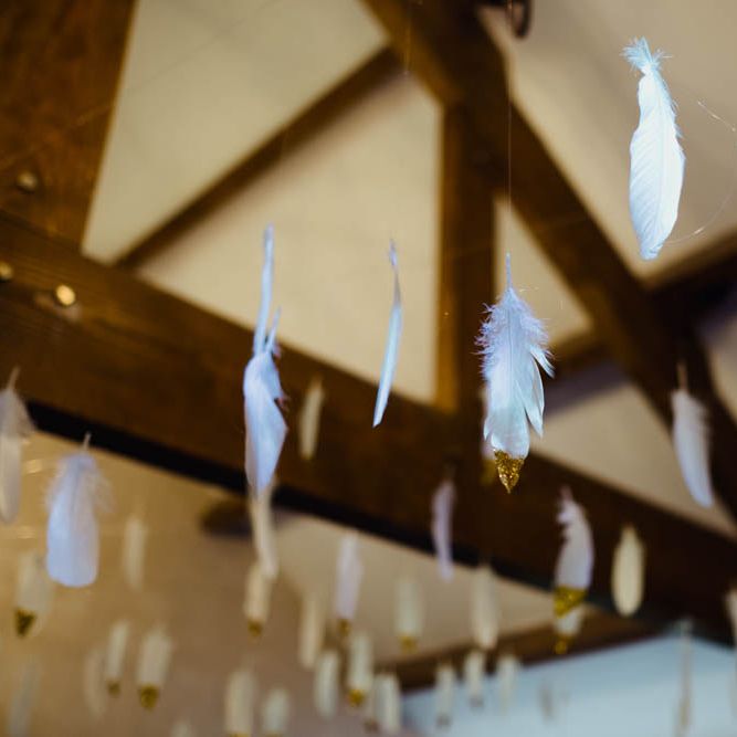 Feather Wedding Decor | Outdoor Wedding at Dewsall Court Oxfordshire | Claudia Rose Carter Photography | Costa Sister Productions