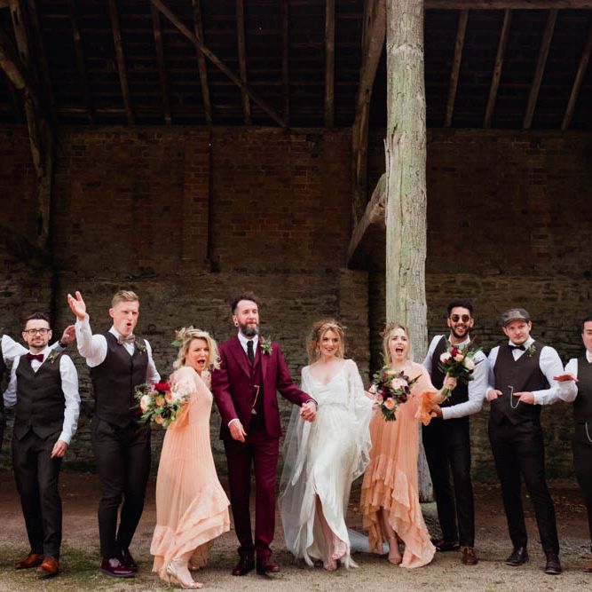 Wedding Party | Bride in Rue de Seine Cleo Wedding Dress | Groom in Burgundy Suit | Bridesmaids in Peach Free People Dresses | Outdoor Wedding at Dewsall Court Oxfordshire | Claudia Rose Carter Photography | Costa Sister Productions