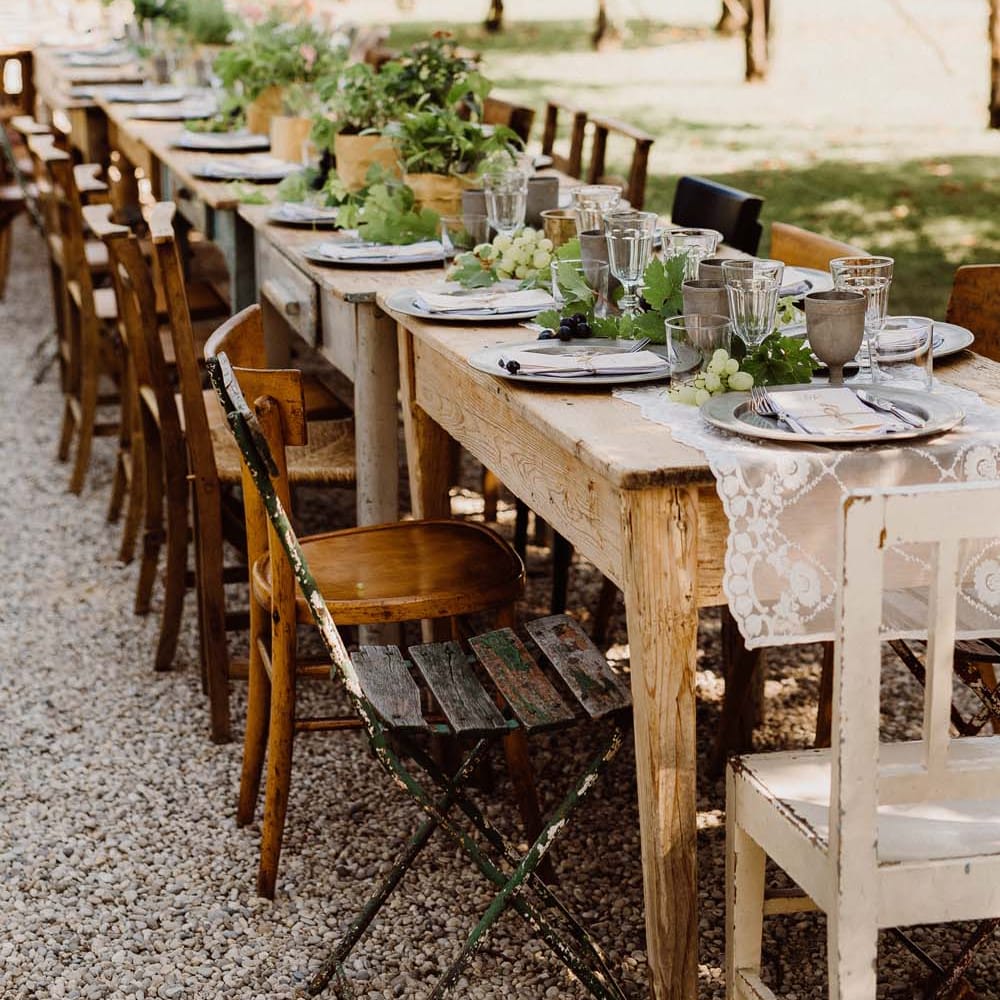 Rustic Wedding In Italy At Locanda Rosa Rosae With Intimate Candle Lit Dinner At Wooden Table With Fresh Fruit Decor