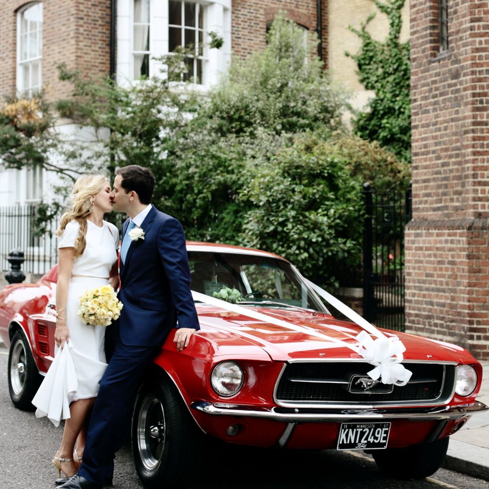 Red Mustang | Bride in Contemporary J Mendel Wedding Dress | Groom in Gieves & Hawkes Suit | Dasha Caffrey Photography
