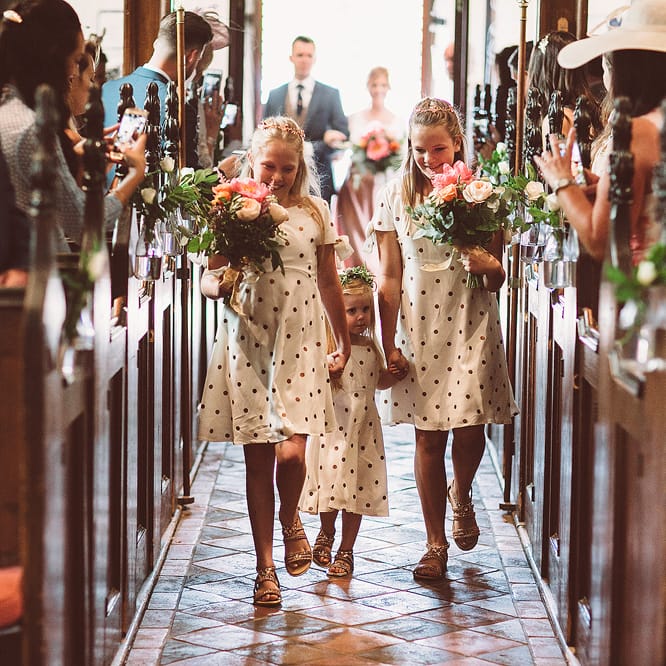 Bridesmaids In Copper Skirts With Cream Tops