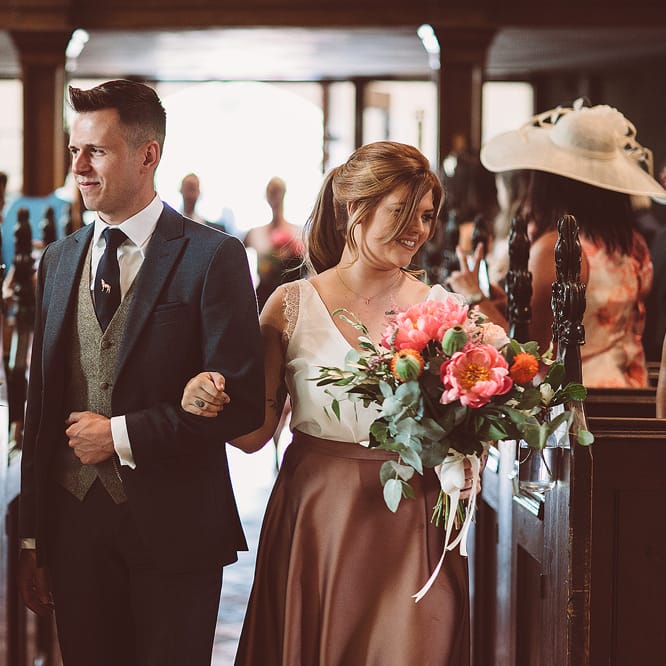 Bridesmaids In Copper Skirts With Cream Tops