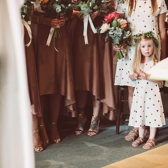 Bridesmaids In Copper Skirts With Cream Tops