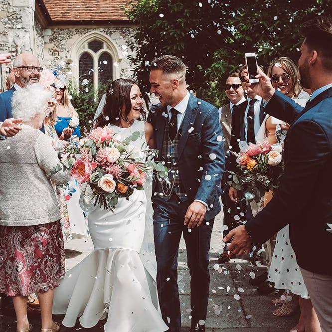 Confetti Shot Of Bride & Groom