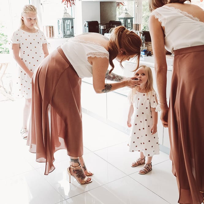Bridesmaids In Copper Skirts With Cream Tops