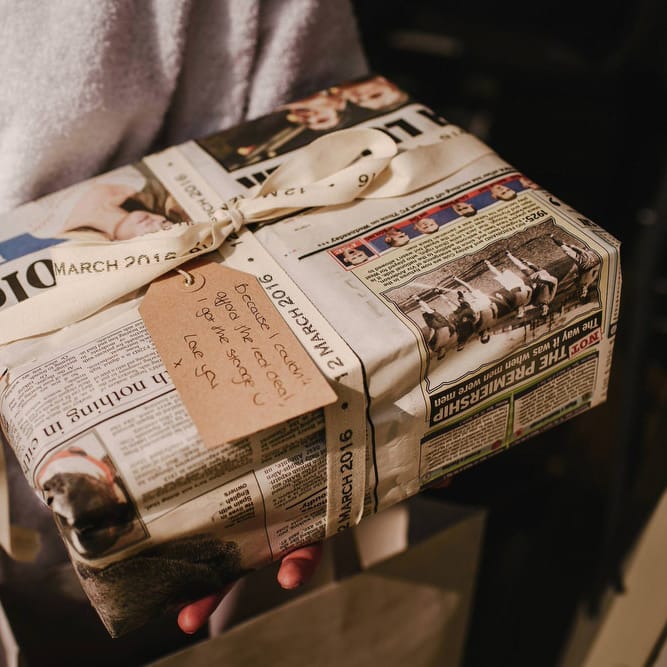 Wedding Present Wrapped in Newspaper | Andy Gaines Photography | Thompson Granger Films