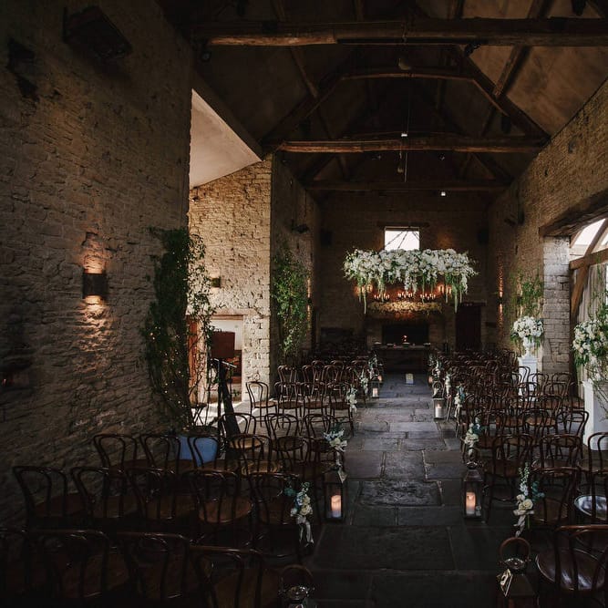 Cripps Barn Ceremony Room | Hanging Floral Display | Aisle Chair Decor | Andy Gaines Photography | Thompson Granger Films