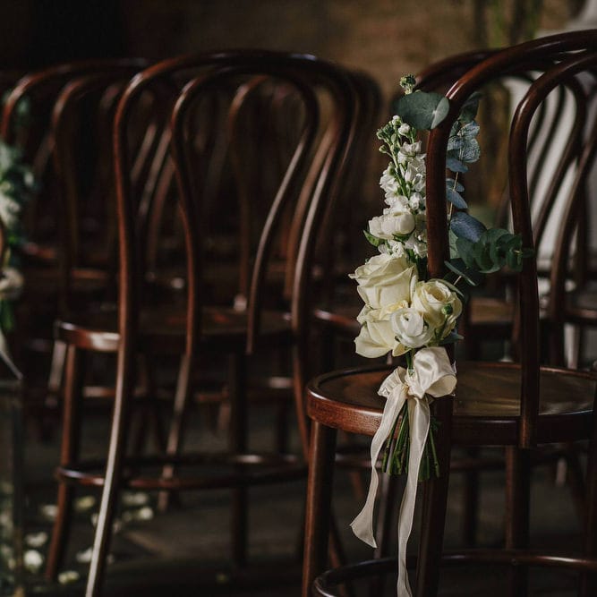 Cripps Barn Ceremony Room | Hanging Floral Display | Aisle Chair Decor | Andy Gaines Photography | Thompson Granger Films