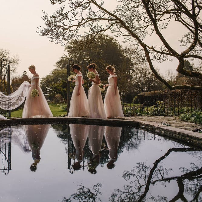 Bride in Christos Costarellos Fishtail Gown | Bridesmaids in Blush Tulle Skirt & White Top Separates | Andy Gaines Photography | Thompson Granger Films