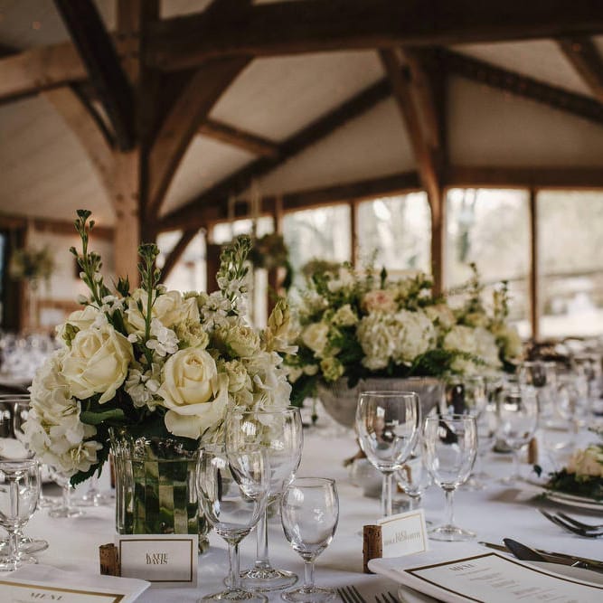 White Floral Centrepieces | Cripps Barn Wedding | Andy Gaines Photography | Thompson Granger Films