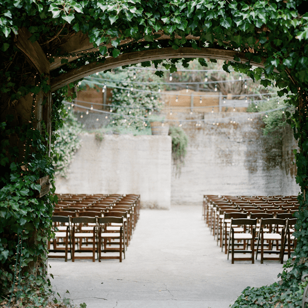 Festoon Lights Aisle | Summer Styling Reimagined | Image via <a href="https://www.oncewed.com" rel="noopener" target="_blank">Once Wed</a> | Image by <a href="https://austingros.com" rel="noopener" target="_blank">Austin Gros</a>