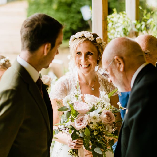 Wedding Ceremony | Bride in Jenny Packham Gown | Groom in Hugo Morris Tweed Suit | Outdoor Ceremony & Rustic Barn Reception at Pennard House Somerset | John Barwood Photography