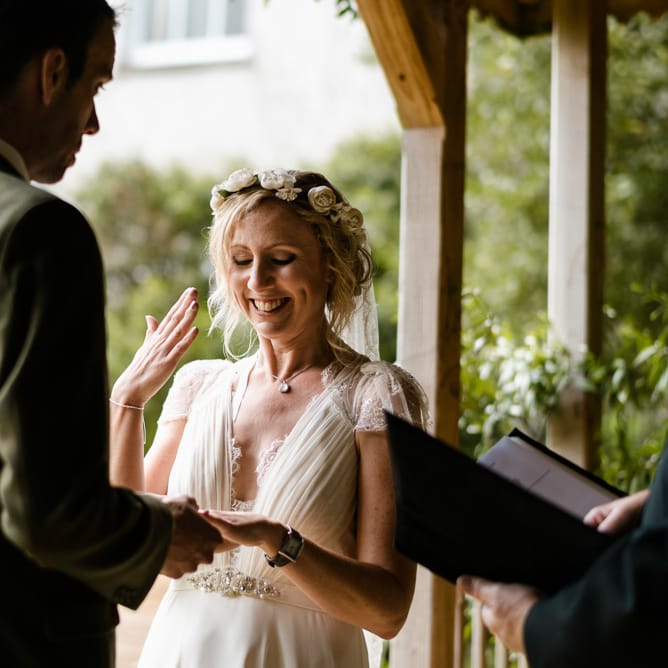 Wedding Ceremony | Bride in Jenny Packham Gown | Groom in Hugo Morris Tweed Suit | Outdoor Ceremony & Rustic Barn Reception at Pennard House Somerset | John Barwood Photography