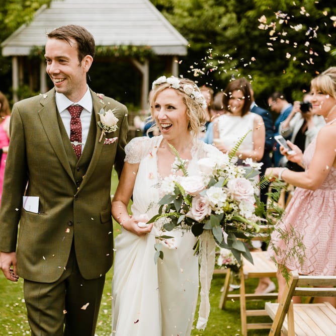 Wedding Ceremony | Bride in Jenny Packham Gown | Groom in Hugo Morris Tweed Suit | Outdoor Ceremony & Rustic Barn Reception at Pennard House Somerset | John Barwood Photography