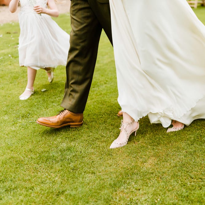 Wedding Ceremony | Aquazzura Bridal Shoes | Loake Brouque Grooms Shoes | Outdoor Ceremony & Rustic Barn Reception at Pennard House Somerset | John Barwood Photography