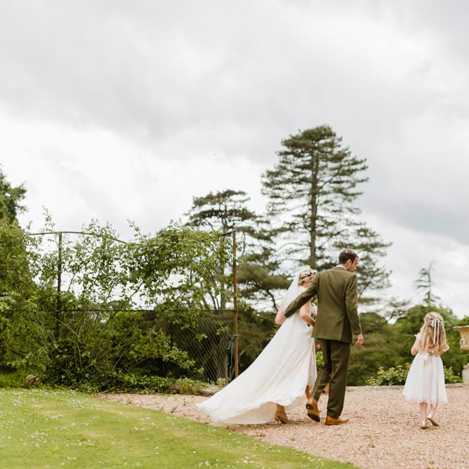 Bride in Jenny Packham Gown | Groom in Hugo Morris Tweed Suit | Outdoor Ceremony & Rustic Barn Reception at Pennard House Somerset | John Barwood Photography