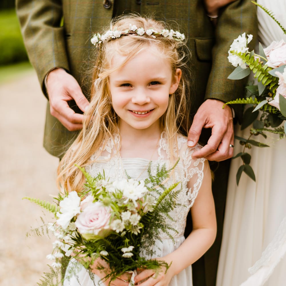 Flower Girl in Ivory Monsoon Dress | Outdoor Ceremony & Rustic Barn Reception at Pennard House Somerset | John Barwood Photography