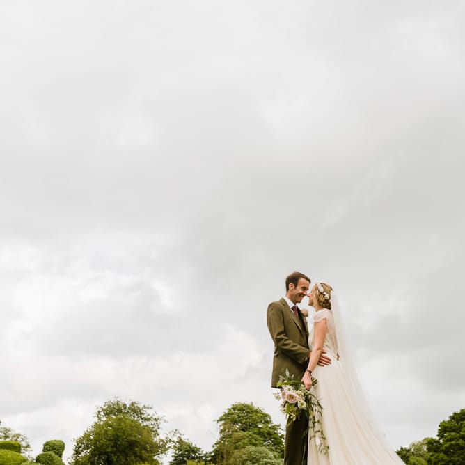 Bride in Jenny Packham Gown | Groom in Hugo Morris Tweed Suit | Outdoor Ceremony & Rustic Barn Reception at Pennard House Somerset | John Barwood Photography