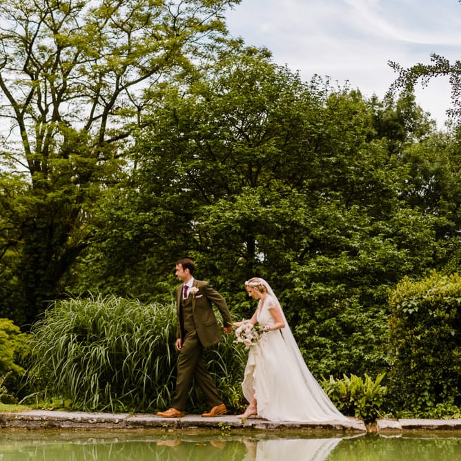 Bride in Jenny Packham Gown | Groom in Hugo Morris Tweed Suit | Outdoor Ceremony & Rustic Barn Reception at Pennard House Somerset | John Barwood Photography