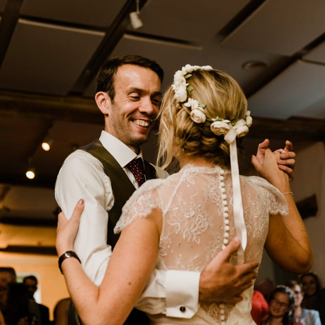 First Dance | Bride in Jenny Packham Gown | Groom in Hugo Morris Tweed Suit | Outdoor Ceremony & Rustic Barn Reception at Pennard House Somerset | John Barwood Photography