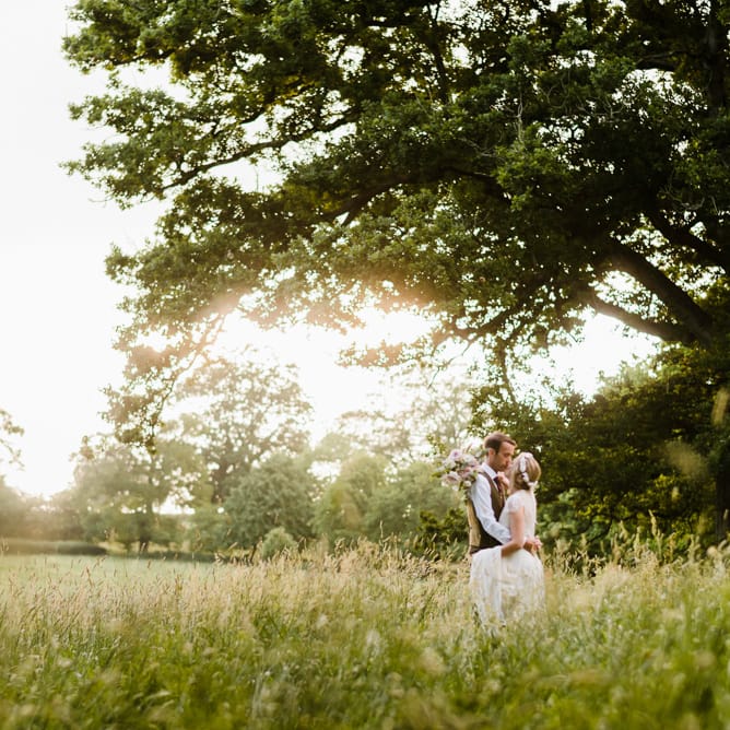 Bride in Jenny Packham Gown | Groom in Hugo Morris Tweed Suit | Outdoor Ceremony & Rustic Barn Reception at Pennard House Somerset | John Barwood Photography