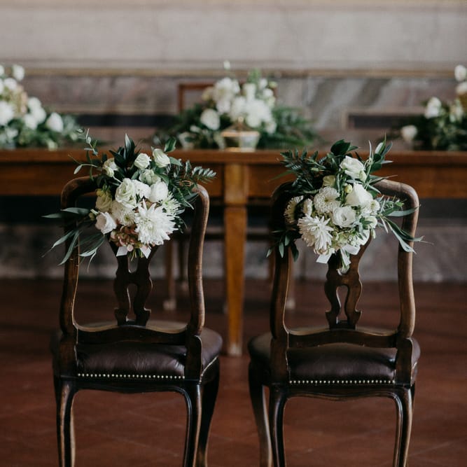 White & Greenery Floral Chair Back Decor | That Day Wedding Planner | Carla Penoncelli Photography