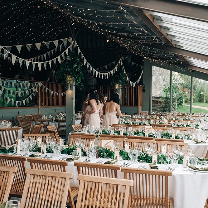 Stone Barn Wedding Reception // Rue De Seine Bride For A Stone Barn Wedding With Wedding Party In Soft Pink And Navy And Images From Jason Mark Harris With Film By Harris Films
