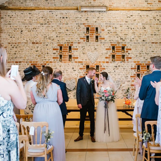 Wedding Ceremony | Bride in Sarah Seven Gown | Groom in Ted Baker & Next | DIY Wedding at Upwaltham Barns with Bright Flowers | Danielle Victoria Photography