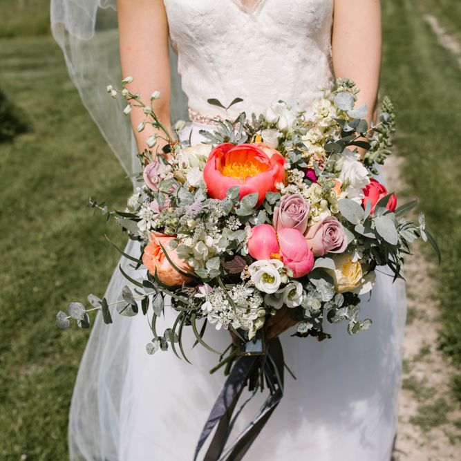 Coral Peony, Rose & Eucalyptus Wedding Bouquet with Ribbon | Sarah Seven Dress | DIY Wedding at Upwaltham Barns with Bright Flowers | Danielle Victoria Photography