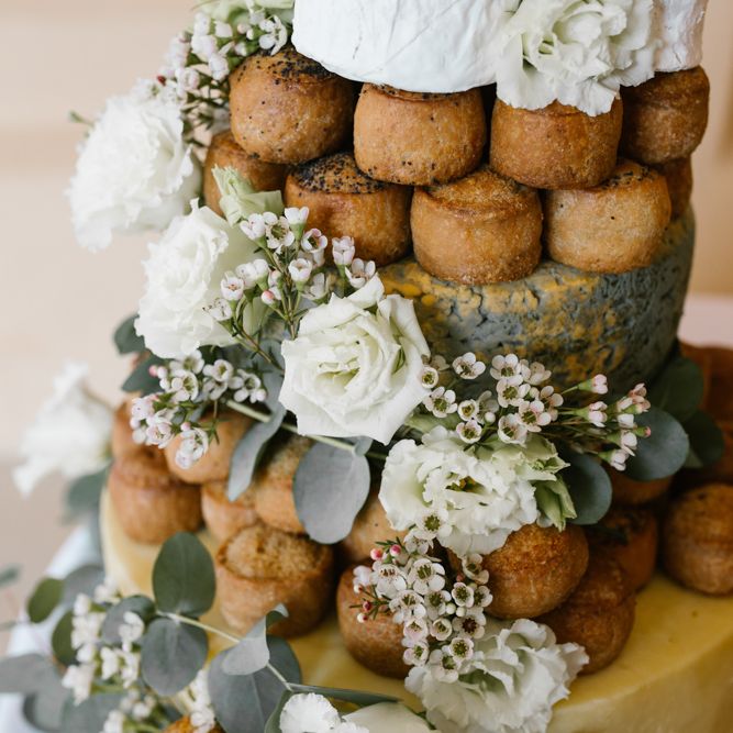 Pork Pies Wedding Cake on Rustic Tree Stump Cake Stand | DIY Wedding at Upwaltham Barns with Bright Flowers | Danielle Victoria Photography