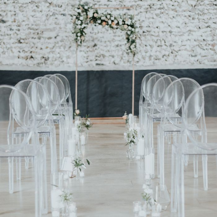 Perspex Chairs & Floral Ceremony Arch For Wedding