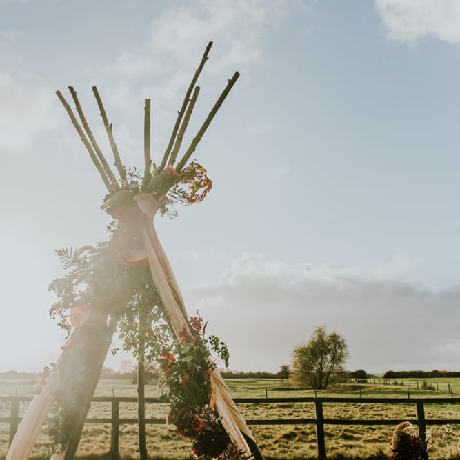 Naked Tipi Wedding Altar & Hay Bale Seating For Wedding Ceremony
