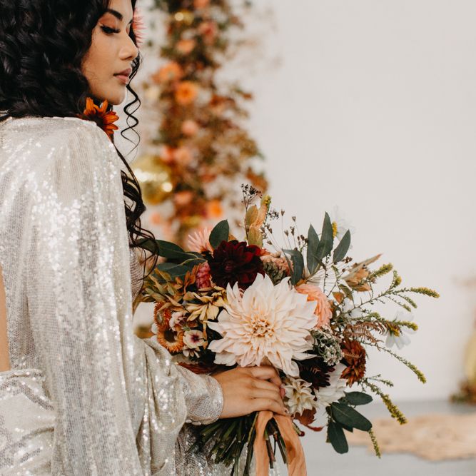 Bride in silver sequin wedding dress for 70s Disco wedding inspiration