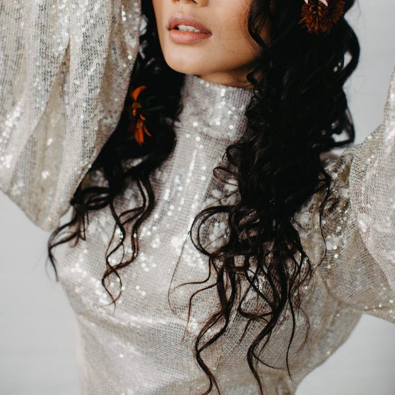 Wedding makeup and wavy hair for 70s disco inspiration