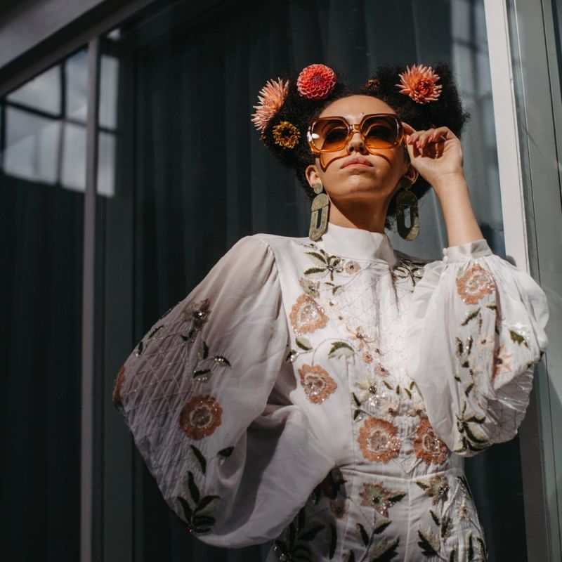 Stylish bride in floral jumpsuit for 70s Disco wedding inspiration