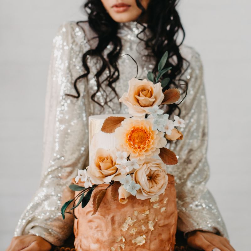 Wedding cake with rust and gold decor