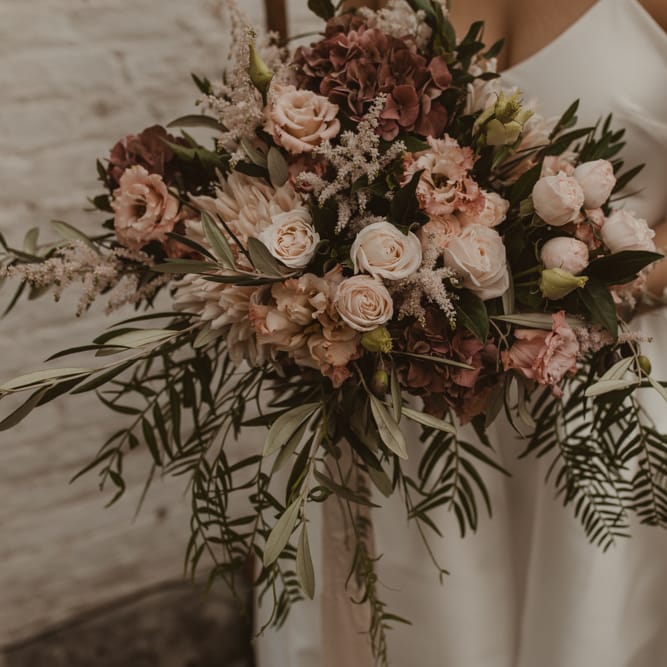 Oversized Romantic Bridal Bouquet with Pink Roses, Dahlias, Hydrangeas &amp; Foliage | Romantic Pink and Gold Wedding Inspiration in a Modern Summer House at Garthmyl Hall by KnockKnockPenny Studio | Nesta Lloyd Photography