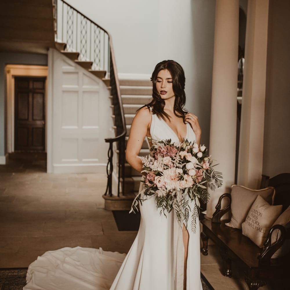 Beautiful Bride in V Neck Strap Wedding Dress with Front Split &amp; Puddle Train | Oversized Pink &amp; Foliage Wedding bouquet | Romantic Pink and Gold Wedding Inspiration in a Modern Summer House at Garthmyl Hall by KnockKnockPenny Studio | Nesta Lloyd Photography
