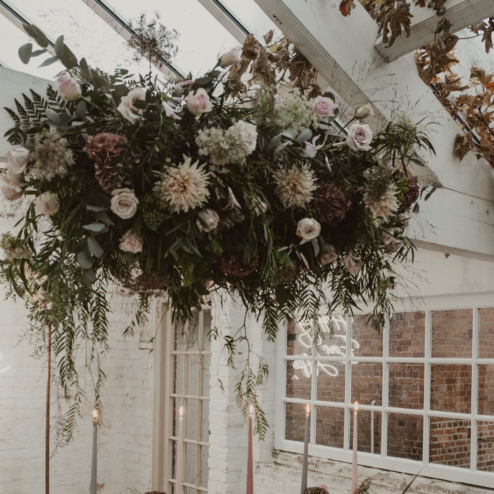 Hanging Floral Installation &amp; Tablescape with Floral Centrepieces &amp; Taper Candles | Romantic Pink and Gold Wedding Inspiration in a Modern Summer House at Garthmyl Hall by KnockKnockPenny Studio | Nesta Lloyd Photography