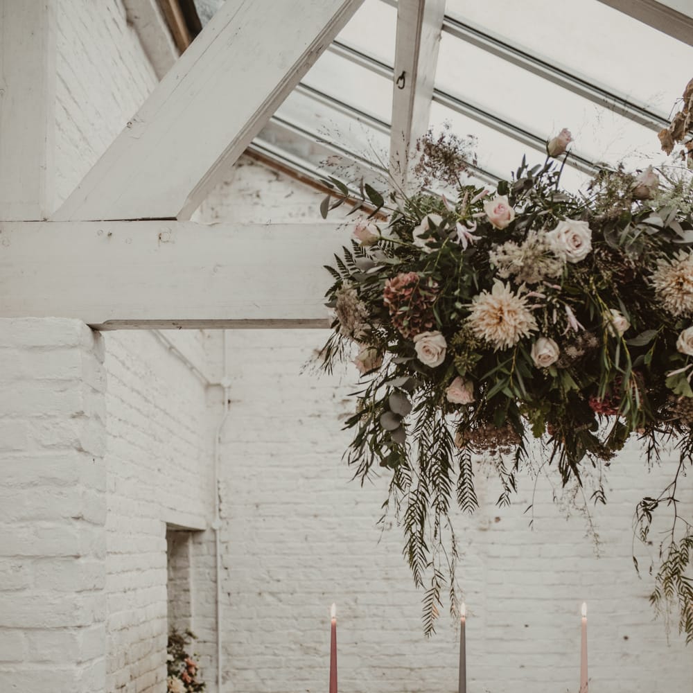Hanging Floral Installation &amp; Tablescape with Floral Centrepieces &amp; Taper Candles | Romantic Pink and Gold Wedding Inspiration in a Modern Summer House at Garthmyl Hall by KnockKnockPenny Studio | Nesta Lloyd Photography