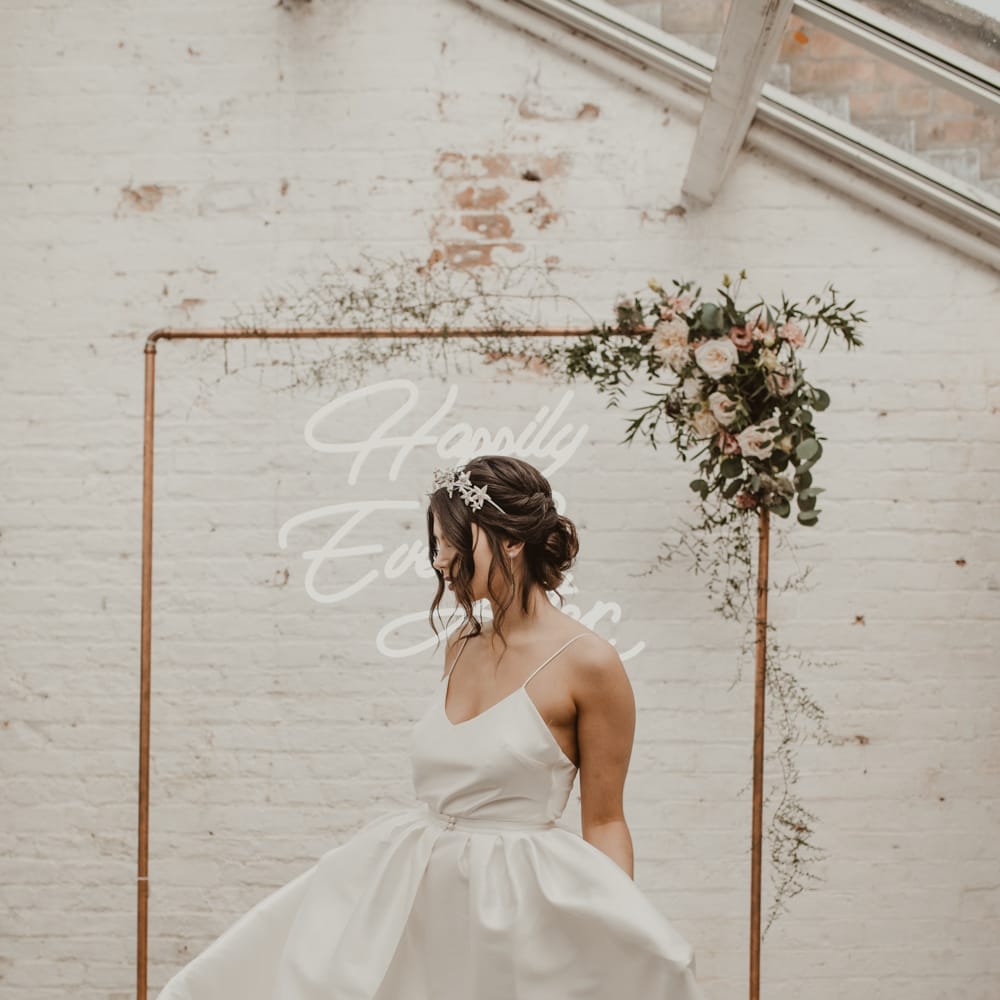 Hanging Neon Happily Ever After Sign on Cooper Frame Wedding Decor | Beautiful Bride in Spaghetti Strap Dress &amp; Star Headdress | Romantic Pink and Gold Wedding Inspiration in a Modern Summer House at Garthmyl Hall by KnockKnockPenny Studio | Nesta Lloyd Photography