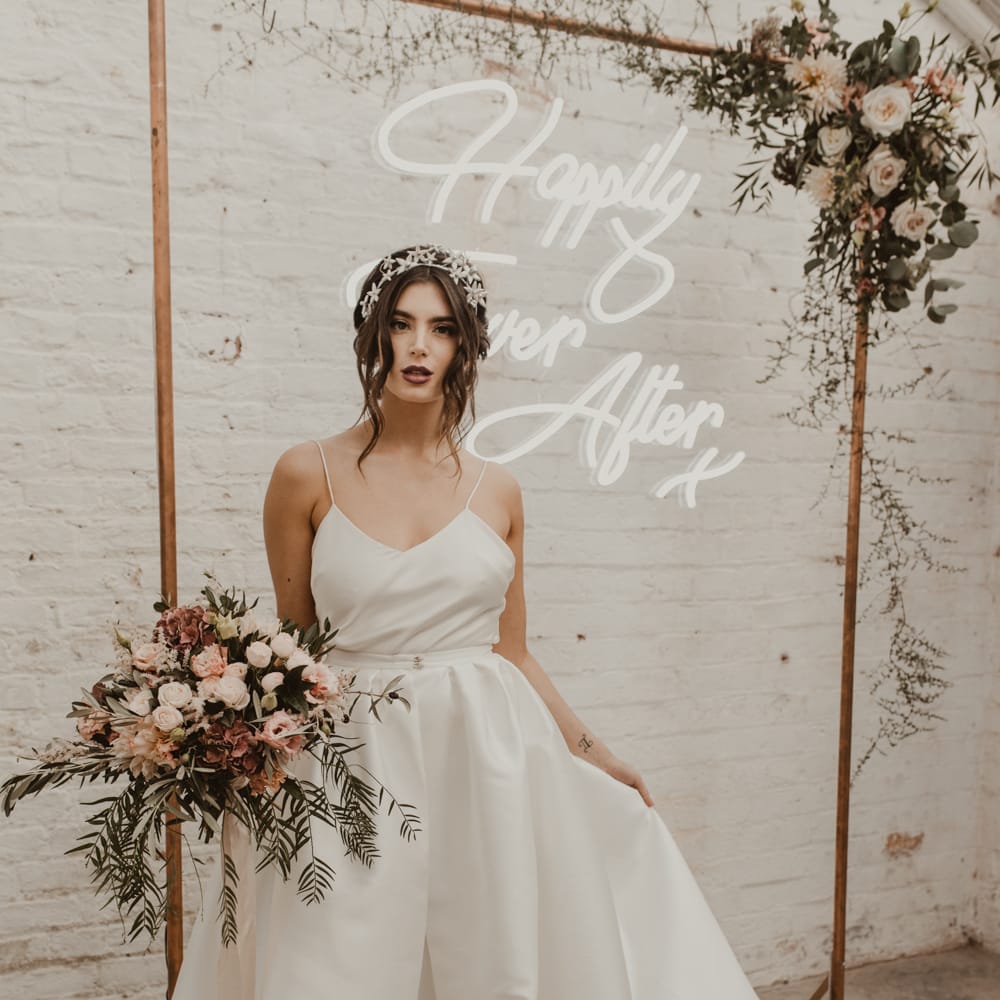 Hanging Neon Happily Ever After Sign on Cooper Frame Wedding Decor | Beautiful Bride in Spaghetti Strap Dress &amp; Star Headdress | Romantic Pink and Gold Wedding Inspiration in a Modern Summer House at Garthmyl Hall by KnockKnockPenny Studio | Nesta Lloyd Photography