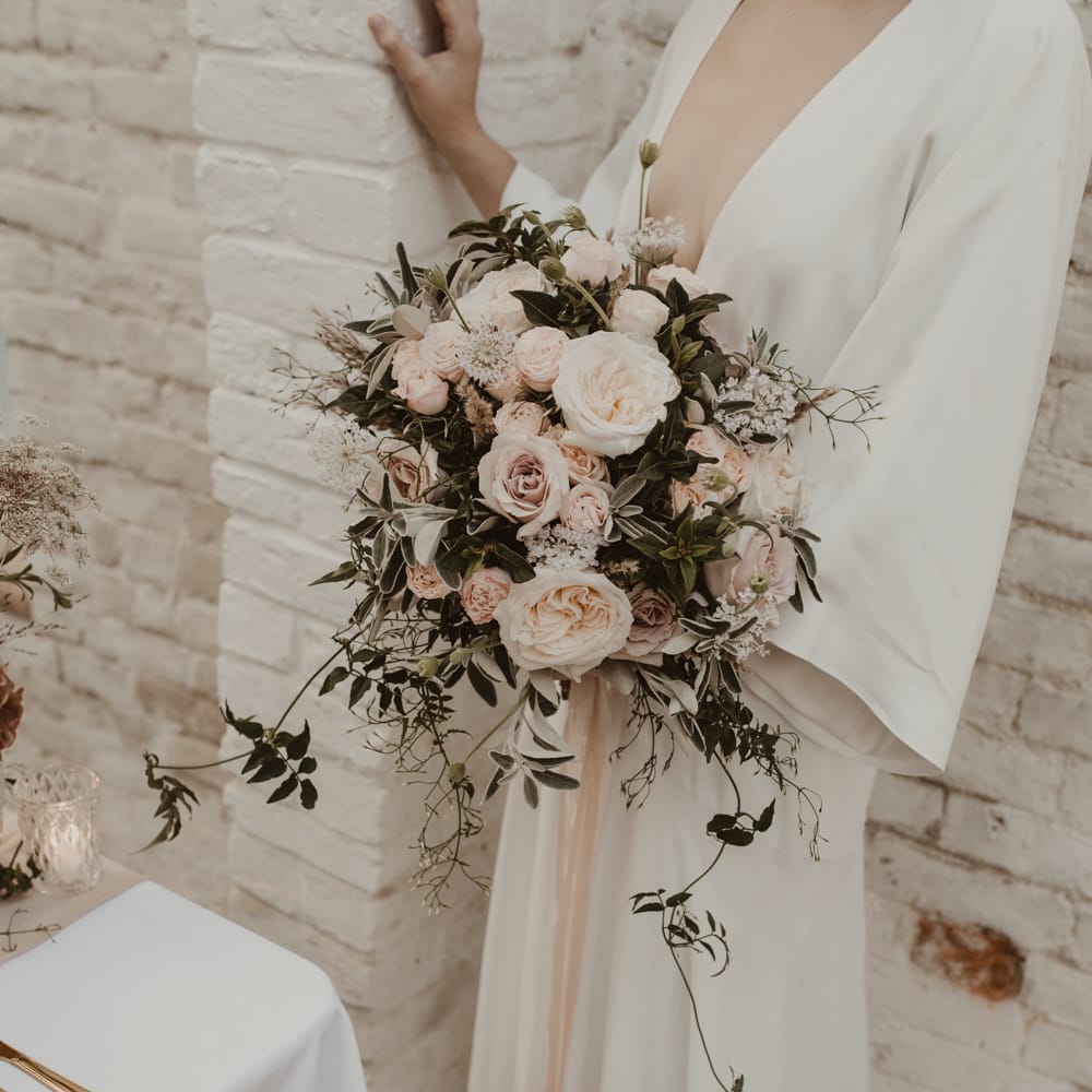 Baby Pink Rose Wedding Bouquet | Beautiful Bride in Wrap Wedding Dress &amp; Vine Headpiece | Romantic Pink and Gold Wedding Inspiration in a Modern Summer House at Garthmyl Hall by KnockKnockPenny Studio | Nesta Lloyd Photography
