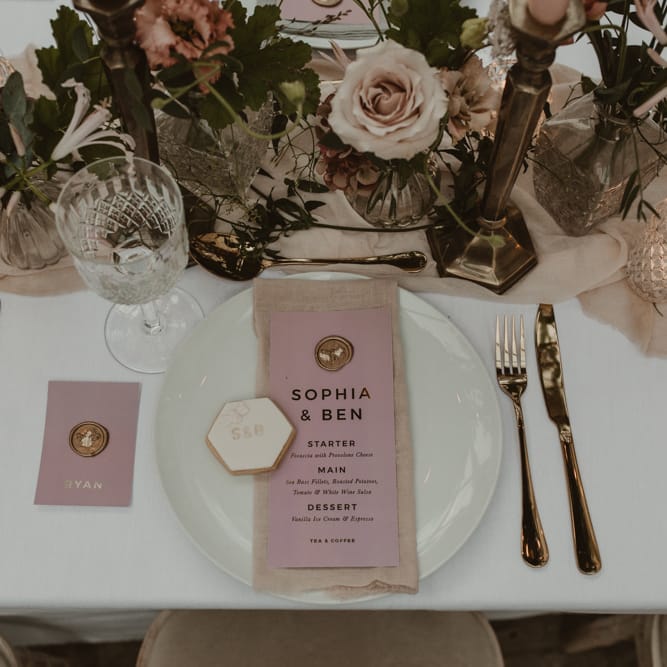 Place Setting with Pink &amp; Gold Foil Menu Card with Wax Seal by Knockknockpenny Studio  on a Tablescape with Floral Centrepieces &amp; Taper Candles | Romantic Pink and Gold Wedding Inspiration in a Modern Summer House at Garthmyl Hall by KnockKnockPenny Studio | Nesta Lloyd Photography