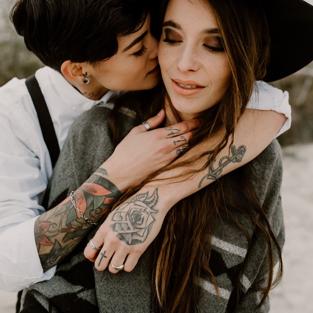 Bride in Portez Vos Idées Black Wedding Dress | Bride in Black Trousers, White Shirt &amp; Braces | Wild Same Sex Couple Wedding Inspiration Shoot | Anne Letournel Photography