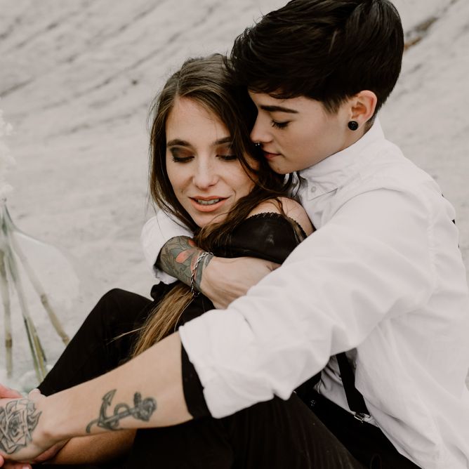 Bride in Portez Vos Idées Black Wedding Dress | Bride in Black Trousers, White Shirt &amp; Braces | Wild Same Sex Couple Wedding Inspiration Shoot | Anne Letournel Photography