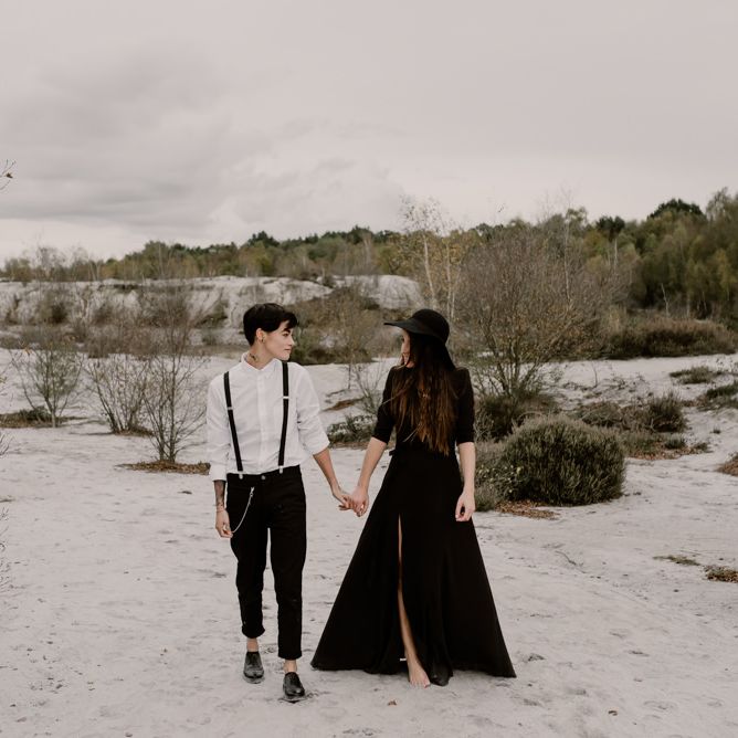 Bride in Portez Vos Idées Black Wedding Dress | Bride in Black Trousers, White Shirt &amp; Braces | Wild Same Sex Couple Wedding Inspiration Shoot | Anne Letournel Photography